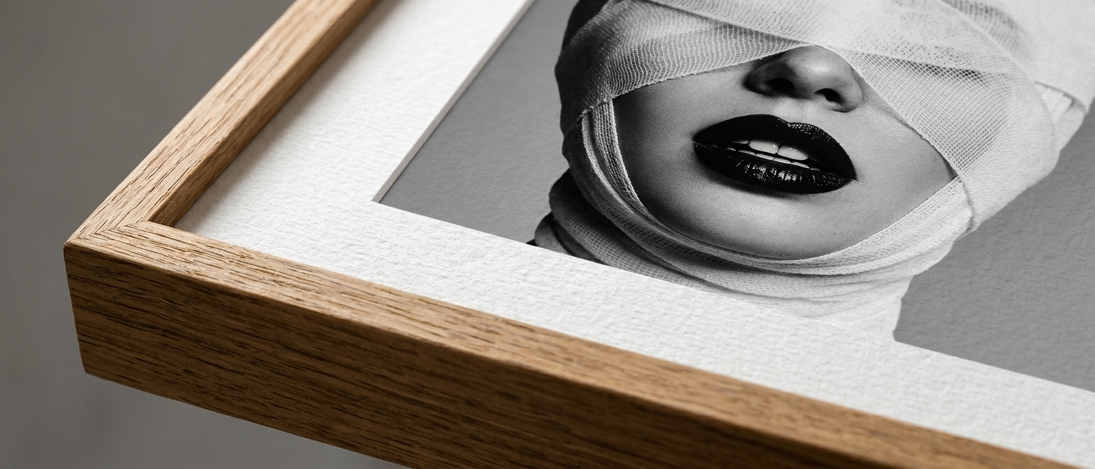 Close-up of surreal portrait printed on matte fine art paper in a clean frame